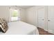 A cozy bedroom with a white door and carpeted floors at 3637 Allenby Pl, Monroe, NC 28110