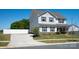 Beautiful two-story home with classic shutters, a lush lawn, and a paved driveway at 3637 Allenby Pl, Monroe, NC 28110