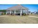 Community gazebo with picnic tables, stone pillars, and a well-maintained lawn, great for gatherings at 3637 Allenby Pl, Monroe, NC 28110