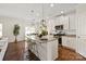 Bright kitchen with an island, granite countertops, stainless appliances, and a view of the dining area at 3637 Allenby Pl, Monroe, NC 28110