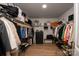 Spacious walk-in closet with built-in shelving, wood floors, and ample storage for clothes and shoes at 3637 Allenby Pl, Monroe, NC 28110