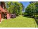 Large backyard with fence and stairs leading to deck above at 364 Stone Cliff Ln, Clover, SC 29710