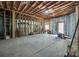 Unfinished basement with exposed framing and door to the outside at 364 Stone Cliff Ln, Clover, SC 29710
