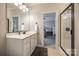 Bathroom view from vanity area, showing a glimpse of the neutral-toned bedroom through an open doorway at 364 Stone Cliff Ln, Clover, SC 29710