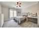 Cozy bedroom featuring a ceiling fan, window with natural light, and a desk area for work or study at 364 Stone Cliff Ln, Clover, SC 29710