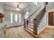 Elegant foyer featuring a grand staircase, hardwood floors, and a decorative glass front door at 364 Stone Cliff Ln, Clover, SC 29710