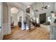 Spacious foyer with hardwood floors, a staircase with iron railings, and views into the living areas at 364 Stone Cliff Ln, Clover, SC 29710