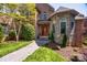 Stunning brick and stone home with a beautifully landscaped entrance and decorative front door at 364 Stone Cliff Ln, Clover, SC 29710