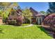 Charming brick home featuring a lush green lawn, mature landscaping, and a welcoming front entrance at 364 Stone Cliff Ln, Clover, SC 29710