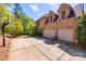 Spacious three-car garage with ample parking and a brick exterior, complemented by a large driveway at 364 Stone Cliff Ln, Clover, SC 29710