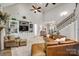 Spacious living room boasts high ceilings, built-in shelving, and a comfortable leather sectional sofa at 364 Stone Cliff Ln, Clover, SC 29710