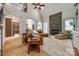 Inviting living room with a stone fireplace, high ceilings, hardwood floors, and open access to other living areas at 364 Stone Cliff Ln, Clover, SC 29710