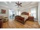 Luxurious main bedroom boasts hardwood floors, tray ceilings, and an adjacent study or office space at 364 Stone Cliff Ln, Clover, SC 29710