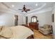 Relaxing main bedroom featuring a ceiling fan, wood floors, and a sitting area at 364 Stone Cliff Ln, Clover, SC 29710