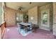 Covered patio area with brick accents, a ceiling fan, and a dining set, perfect for outdoor gatherings at 364 Stone Cliff Ln, Clover, SC 29710