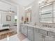 Bathroom boasts dual sinks with granite countertops, modern lighting, and a decorative rug at 4012 Moxie Way, Charlotte, NC 28215