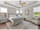 Bedroom boasts a trey ceiling, lots of natural light, and calming neutral color palette at 4012 Moxie Way, Charlotte, NC 28215