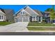 Beautiful home exterior showcasing stone accents, a well-maintained lawn, and an attached two car garage at 4012 Moxie Way, Charlotte, NC 28215