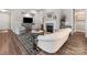 Stylish living room featuring a fireplace, hardwood floors, and modern furniture at 4012 Moxie Way, Charlotte, NC 28215