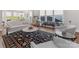 Bright living room with large windows, hardwood floors, and modern decor at 4012 Moxie Way, Charlotte, NC 28215