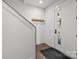 Welcoming entryway with coat rack and dark wood-look flooring at 4019 Plaza Row Ct, Charlotte, NC 28205