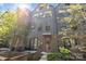 Stylish townhouse featuring gray siding, a brick facade, and a welcoming entrance at 4019 Plaza Row Ct, Charlotte, NC 28205