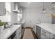Stylish kitchen with stainless steel appliances, white cabinets, and a modern design at 4019 Plaza Row Ct, Charlotte, NC 28205