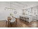 Open concept kitchen and dining area with an island and modern pendant lighting at 4019 Plaza Row Ct, Charlotte, NC 28205