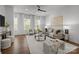 Bright living room featuring hardwood floors, large windows, and neutral tones at 4019 Plaza Row Ct, Charlotte, NC 28205