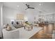 Bright living room features stylish seating, modern decor, and an open layout connecting to the dining area and kitchen at 4019 Plaza Row Ct, Charlotte, NC 28205