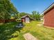 The backyard features a shed, firepit, and brick walkway to side of the house at 4203 Ethel Sustar Dr, Monroe, NC 28110