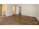 A bright bedroom with hardwood flooring with multiple doors and doorways at 4203 Ethel Sustar Dr, Monroe, NC 28110