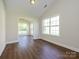 Versatile bonus room with wood floors, natural light, and easy access to other areas at 4203 Ethel Sustar Dr, Monroe, NC 28110