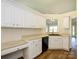 Bright kitchen featuring white cabinets, laminate countertops, and hard surface floors at 4203 Ethel Sustar Dr, Monroe, NC 28110