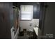 Bathroom needing a makeover, features a bathtub, toilet, and vanity at 4814 Chapel Grove Rd, Gastonia, NC 28052