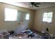 Bedroom needing renovation, features ample natural light from two windows at 4814 Chapel Grove Rd, Gastonia, NC 28052