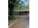 A charming single-story brick home with a mature tree in the front yard at 4814 Chapel Grove Rd, Gastonia, NC 28052