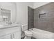 Modern bathroom features gray tile and a shower niche at 508 Clegg St, Shelby, NC 28150