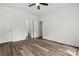 Bedroom featuring wood-look flooring, ceiling fan, and ensuite bathroom at 508 Clegg St, Shelby, NC 28150