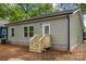 Sage vinyl exterior with a newly installed wood staircase and modern windows at 508 Clegg St, Shelby, NC 28150