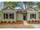 Charming single-story home with light green siding, black shutters and a welcoming front entrance at 508 Clegg St, Shelby, NC 28150