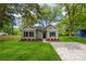Inviting home with lush green lawn, mature trees, and a cozy facade with black shutters at 508 Clegg St, Shelby, NC 28150