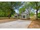 Well-maintained home with a spacious driveway, lush greenery, and fresh landscaping at 508 Clegg St, Shelby, NC 28150
