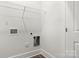 Bright laundry room with wood-style flooring and hookups for washer and dryer at 508 Clegg St, Shelby, NC 28150