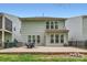 Backyard featuring an outdoor patio and well-maintained vinyl siding at 5150 Mount Clare Ln, Charlotte, NC 28210