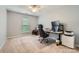 Bedroom set up as an office space with modern computer equipment and neutral carpeting at 5150 Mount Clare Ln, Charlotte, NC 28210