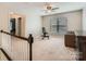 Upstairs bonus room with weight training equipment and a cozy reading chair at 5150 Mount Clare Ln, Charlotte, NC 28210