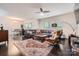 Spacious living room with hardwood floors, a large sectional couch, stylish furniture, and lots of natural light at 5150 Mount Clare Ln, Charlotte, NC 28210