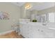 Bathroom featuring double vanity sinks, white cabinets, and tile floor at 536 Wellbourne Nw Ct, Concord, NC 28027