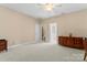 Cozy bedroom featuring neutral walls, a ceiling fan, and carpeted floors at 536 Wellbourne Nw Ct, Concord, NC 28027